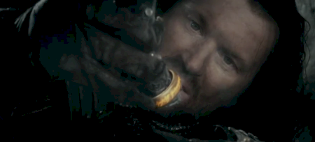 Isildur holds the One Ring.