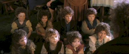 Hobbit children listening to Bilbo's adventure stories.
